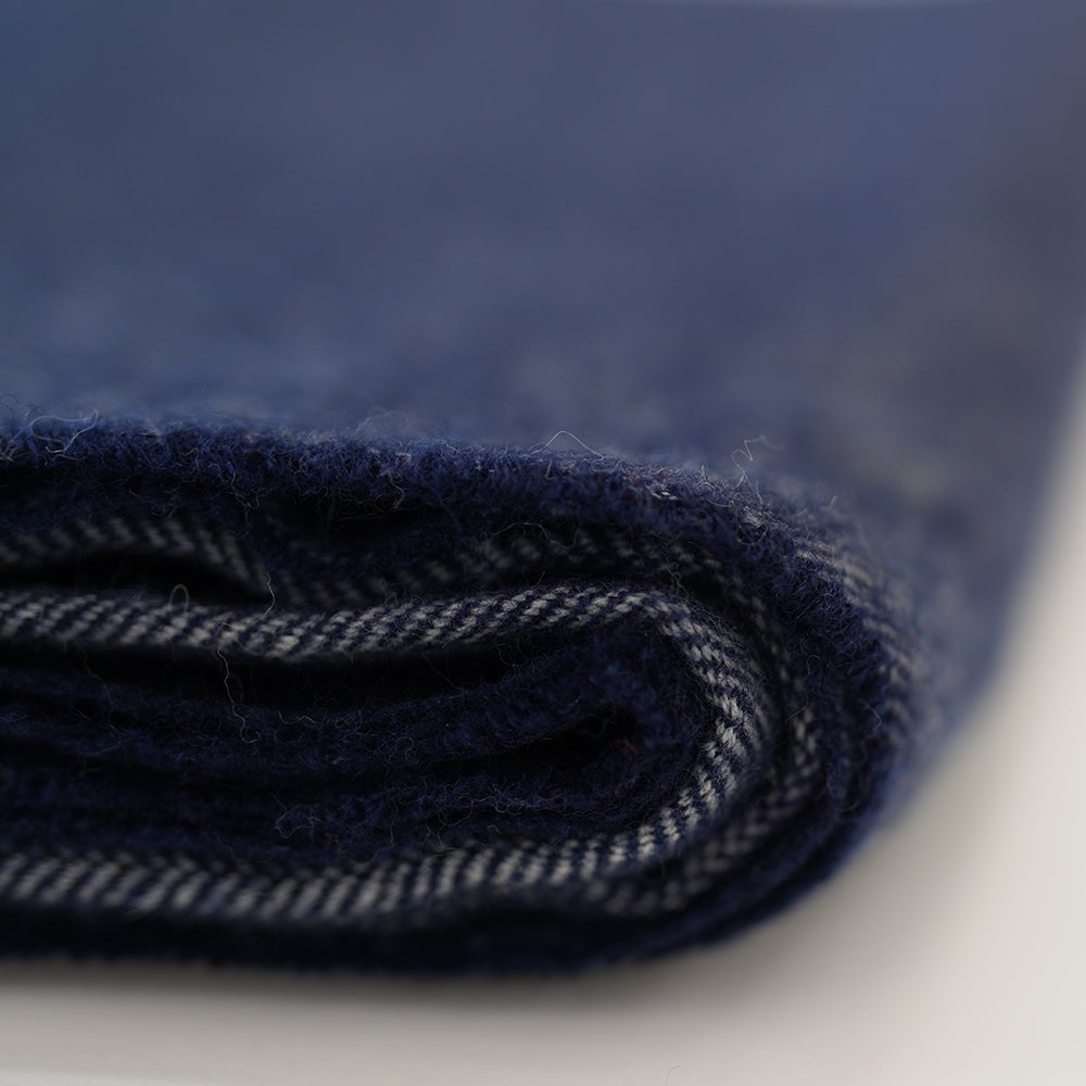 Isobaa | Merino Herringbone Throw (Navy/Orange Stripe) | Wrap yourself in pure comfort with Isobaa's super-soft Merino throw.