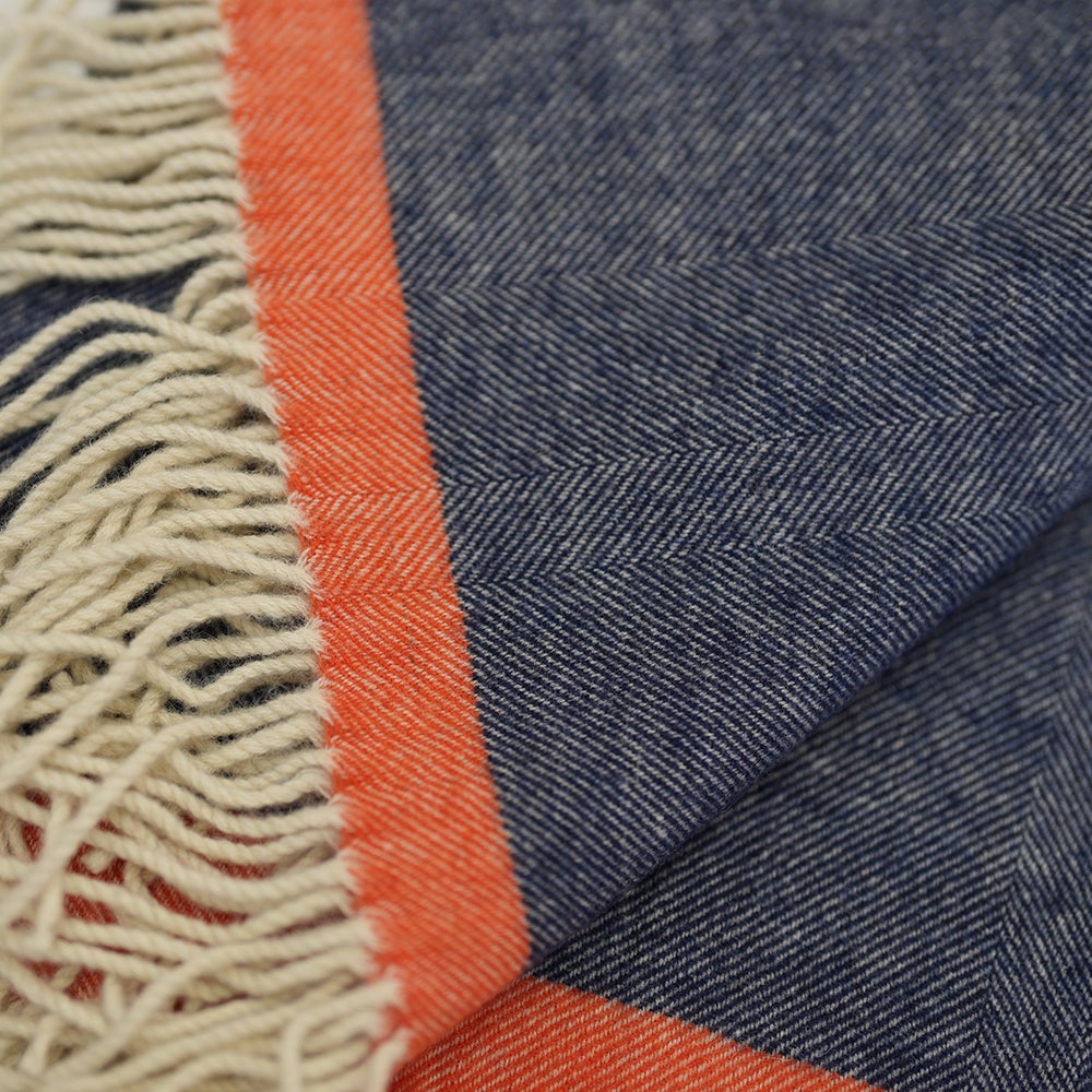 Isobaa | Merino Herringbone Throw (Navy/Orange Stripe) | Wrap yourself in pure comfort with Isobaa's super-soft Merino throw.