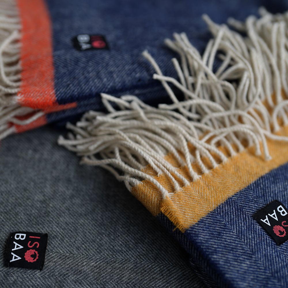 Isobaa | Merino Herringbone Throw (Navy/Orange Stripe) | Wrap yourself in pure comfort with Isobaa's super-soft Merino throw.