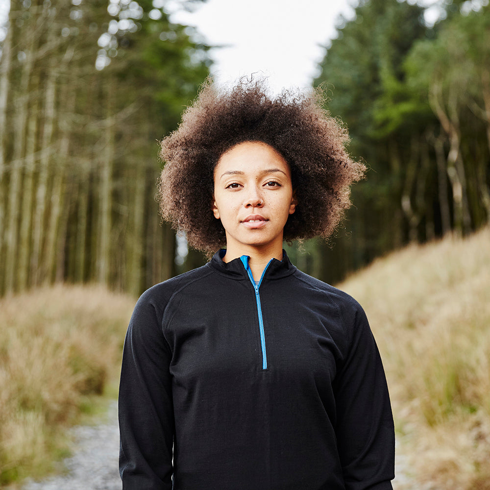 Isobaa | Womens Merino 200 Long Sleeve Zip Neck (Black) | Experience the best of 200gm Merino wool with this ultimate half-zip top – your go-to for challenging hikes, chilly bike commutes, post-workout layering, and unpredictable weather. | Model: Savanah