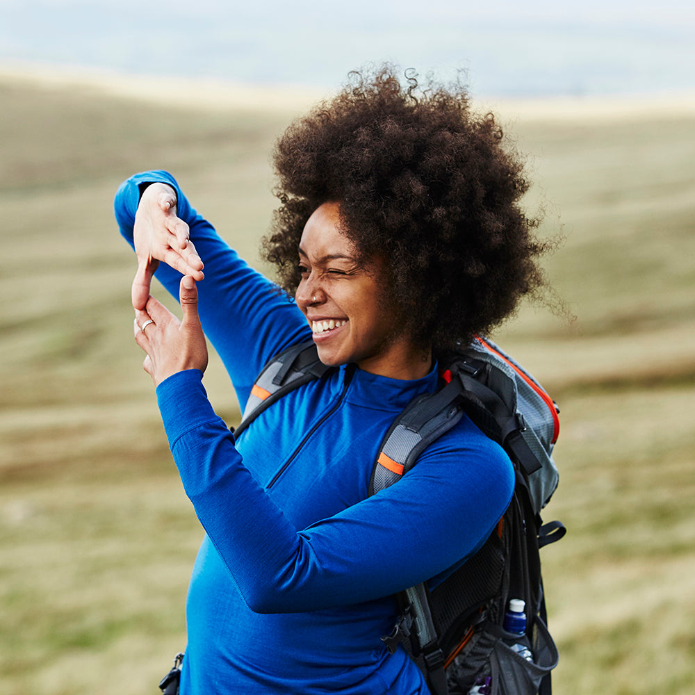 Isobaa | Womens Merino 200 Long Sleeve Zip Neck (Blue) | Experience the best of 200gm Merino wool with this ultimate half-zip top – your go-to for challenging hikes, chilly bike commutes, post-workout layering, and unpredictable weather. | Model: Savanah
