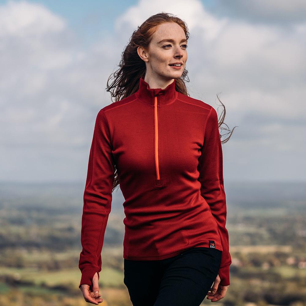 Isobaa | Womens Merino 320 Long Sleeve Half Zip (Red/Orange) | Conquer cold trails, blustery commutes, and unpredictable weather with the ultimate Merino wool half-zip top.