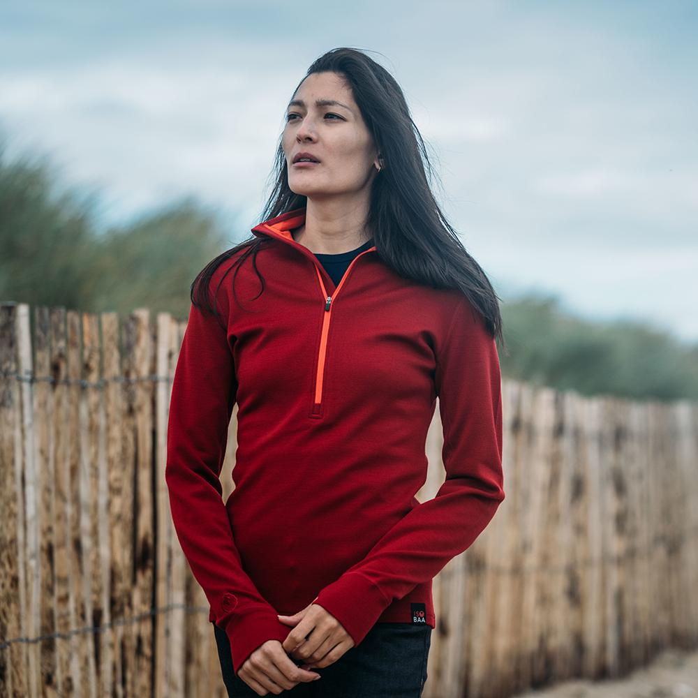 Isobaa | Womens Merino 320 Long Sleeve Half Zip (Red/Orange) | Conquer cold trails, blustery commutes, and unpredictable weather with the ultimate Merino wool half-zip top. | Model: Jessica