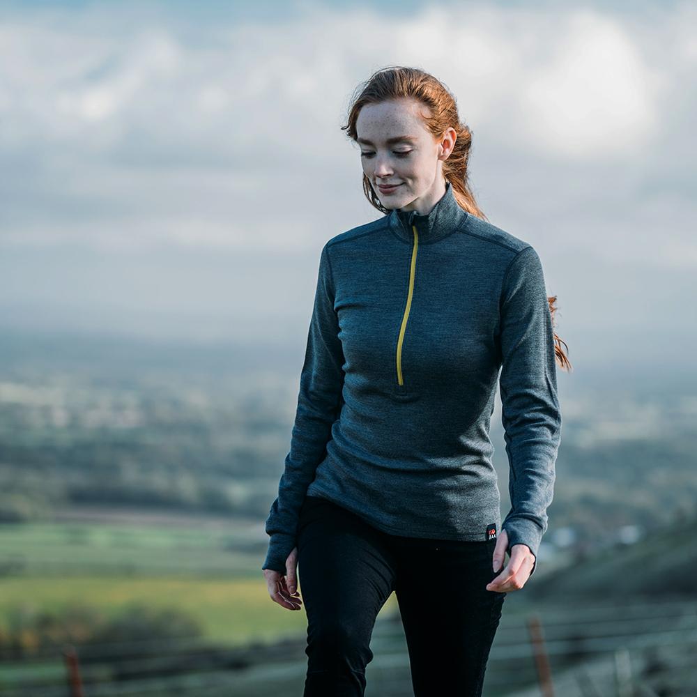 Isobaa | Womens Merino 320 Long Sleeve Half Zip (Smoke/Lime) | Conquer cold trails, blustery commutes, and unpredictable weather with the ultimate Merino wool half-zip top. | Model: Sophie