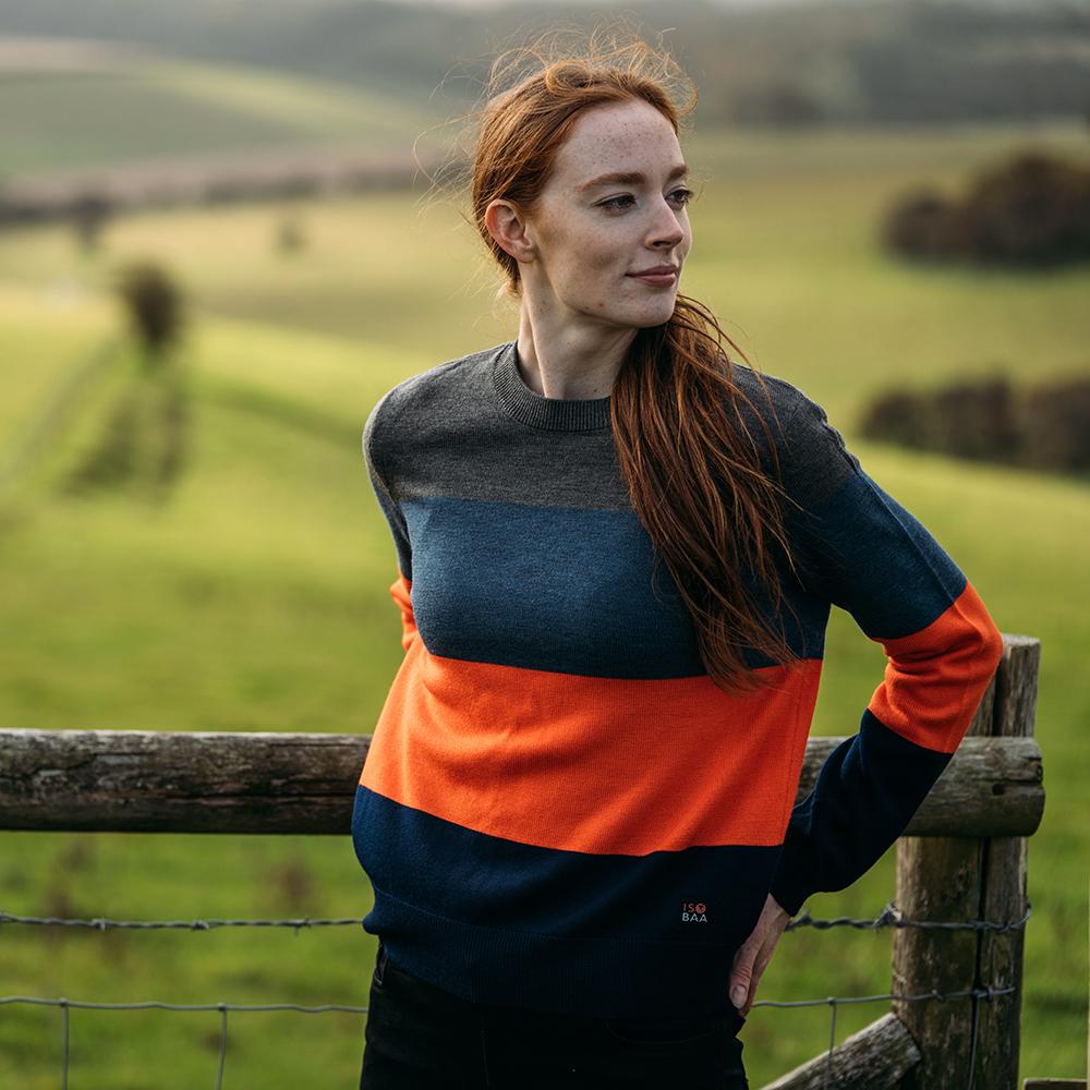 Isobaa | Womens Merino Block Stripe Sweater (Smoke/Denim/Orange/Navy) | Discover effortless style and exceptional comfort with our  extrafine 9-gauge Merino wool crew neck sweater.