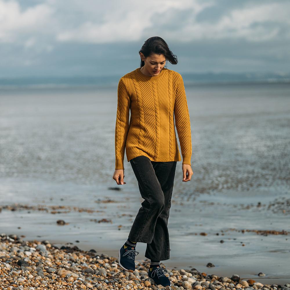 Isobaa | Womens Merino Cable Sweater (Mustard) | Experience timeless style and outdoor-ready performance with our Merino wool crew neck sweater. | Model: Jessica