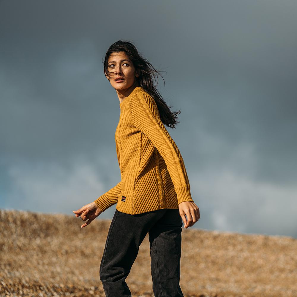 Isobaa | Womens Merino Cable Sweater (Mustard) | Experience timeless style and outdoor-ready performance with our Merino wool crew neck sweater. | Model: Jessica