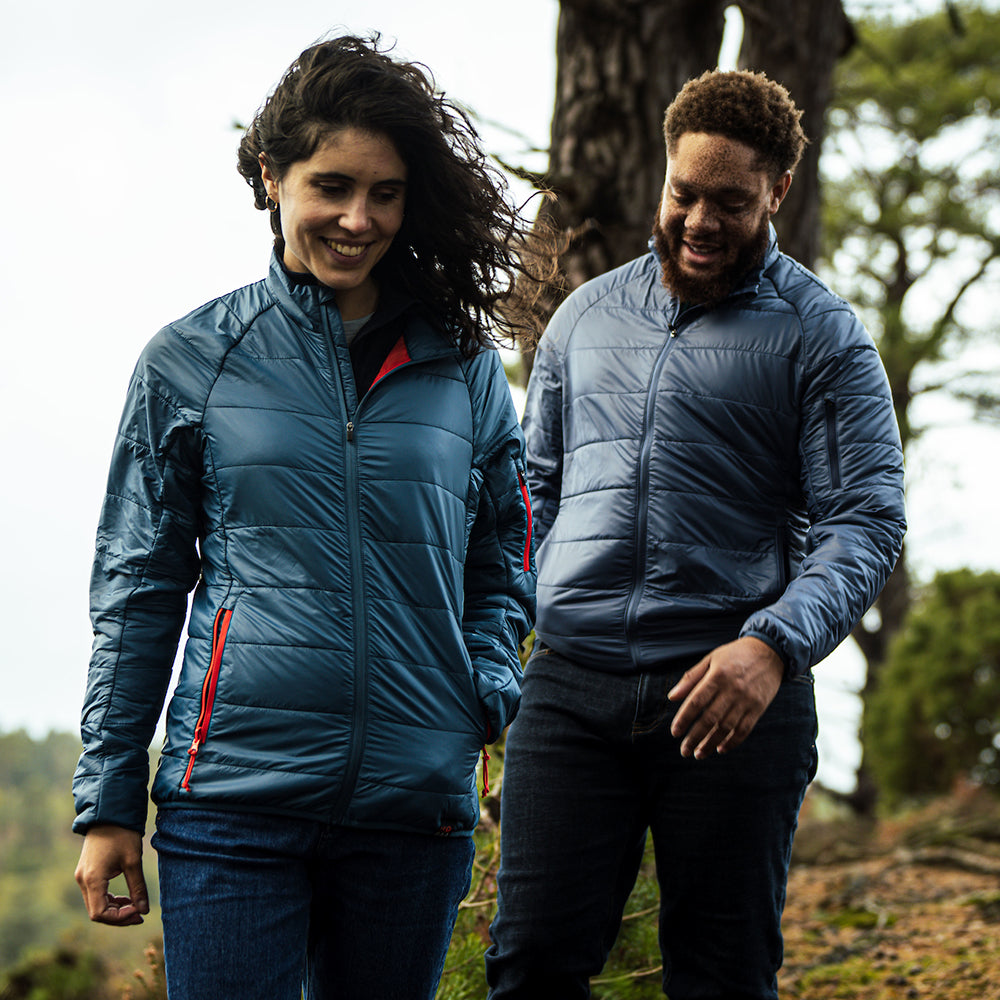 Isobaa | Womens Packable Insulated Jacket (Petrol/Orange) | Exceptional warmth, packable convenience, and sustainable design with our lightweight Merino wool jacket. | Model: Clémentine