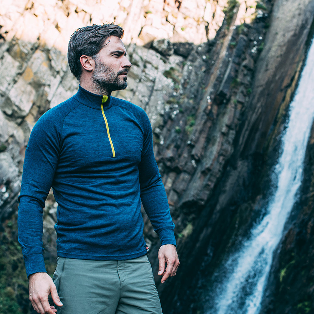 Isobaa | Mens Merino 200 Long Sleeve Zip Neck (Petrol) | Experience the best of 200gm Merino wool with this ultimate half-zip top – your go-to for challenging hikes, chilly bike commutes, post-workout layering, and unpredictable weather. | Model: Duncan
