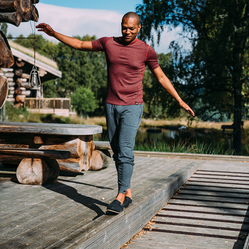 Isobaa | Mens Merino 260 Lounge Cuffed Joggers (Smoke/Black) | Discover unparalleled comfort and versatility with our luxurious 260gm Merino wool lounge joggers. | Model: Edirin