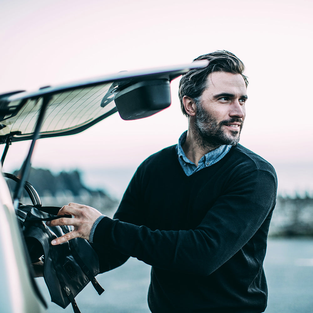 Isobaa | Mens Merino V Neck Sweater (Black) | Stay comfortable on the go with our V-neck sweater crafted from superfine Merino wool. | Model: Duncan