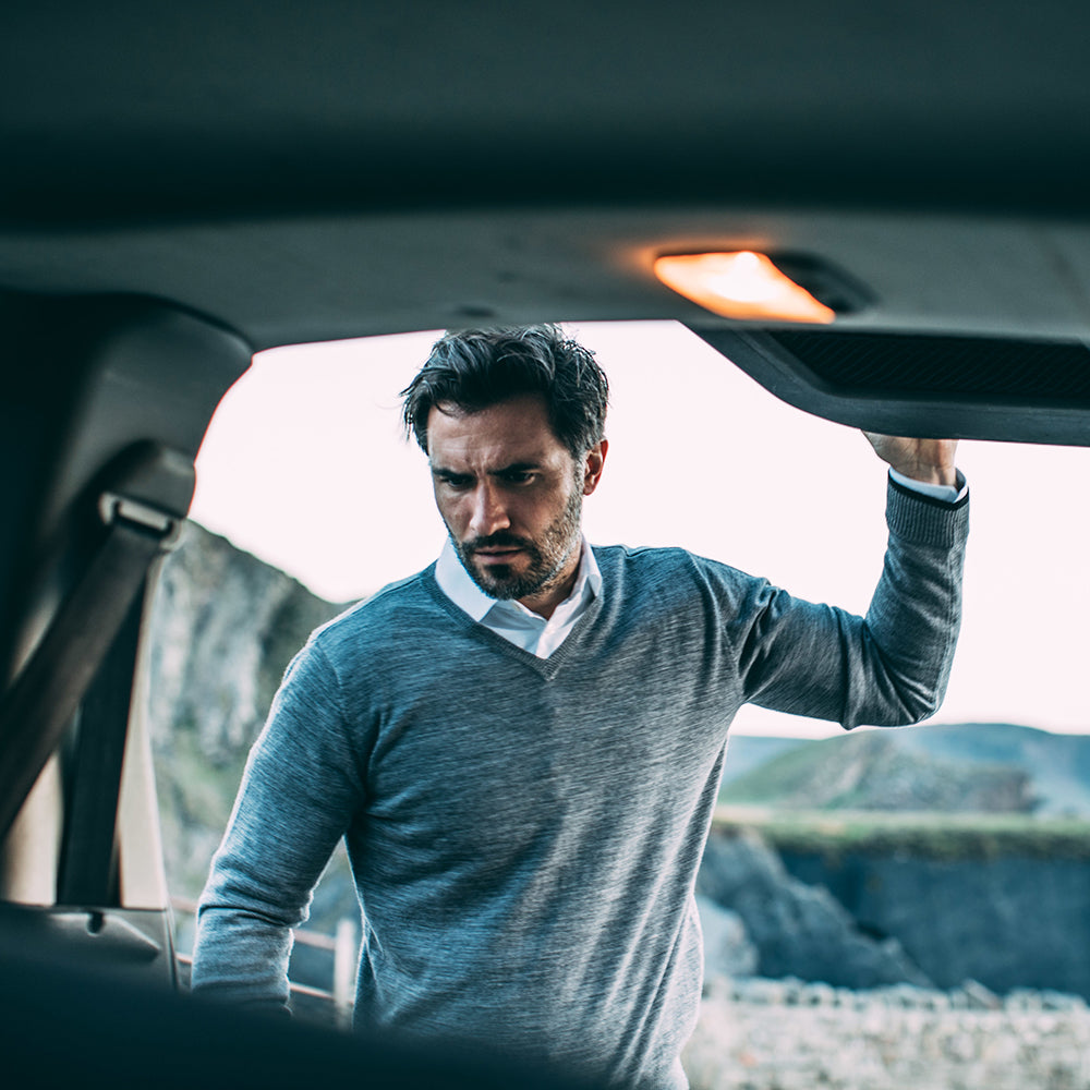 Isobaa | Mens Merino V Neck Sweater (Charcoal) | Stay comfortable on the go with our V-neck sweater crafted from superfine Merino wool. | Model: Duncan