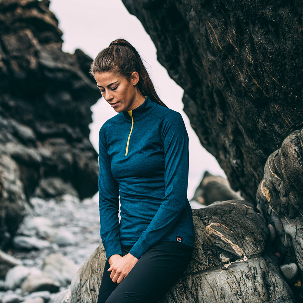 Isobaa | Womens Merino 200 Long Sleeve Zip Neck (Petrol) | Experience the best of 200gm Merino wool with this ultimate half-zip top – your go-to for challenging hikes, chilly bike commutes, post-workout layering, and unpredictable weather. | Model: Jess