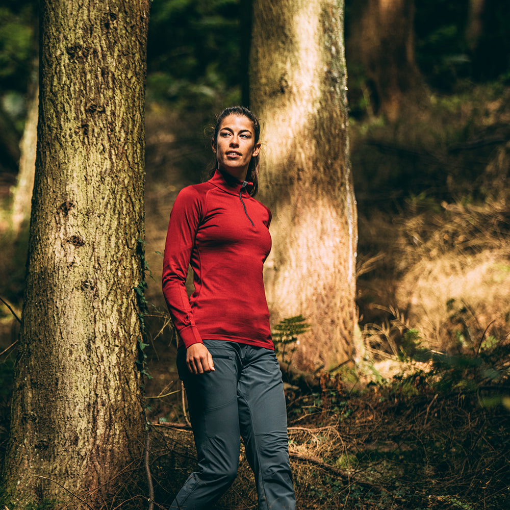 Isobaa | Womens Merino 200 Long Sleeve Zip Neck (Red) | Experience the best of 200gm Merino wool with this ultimate half-zip top – your go-to for challenging hikes, chilly bike commutes, post-workout layering, and unpredictable weather. | Model: Jess