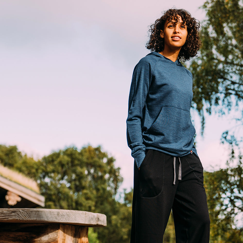Isobaa | Womens Merino 260 Lounge Hoodie (Denim/Navy) | Experience the best in comfort and performance with our midweight 260gm Merino wool pullover hoodie. | Model: Micah