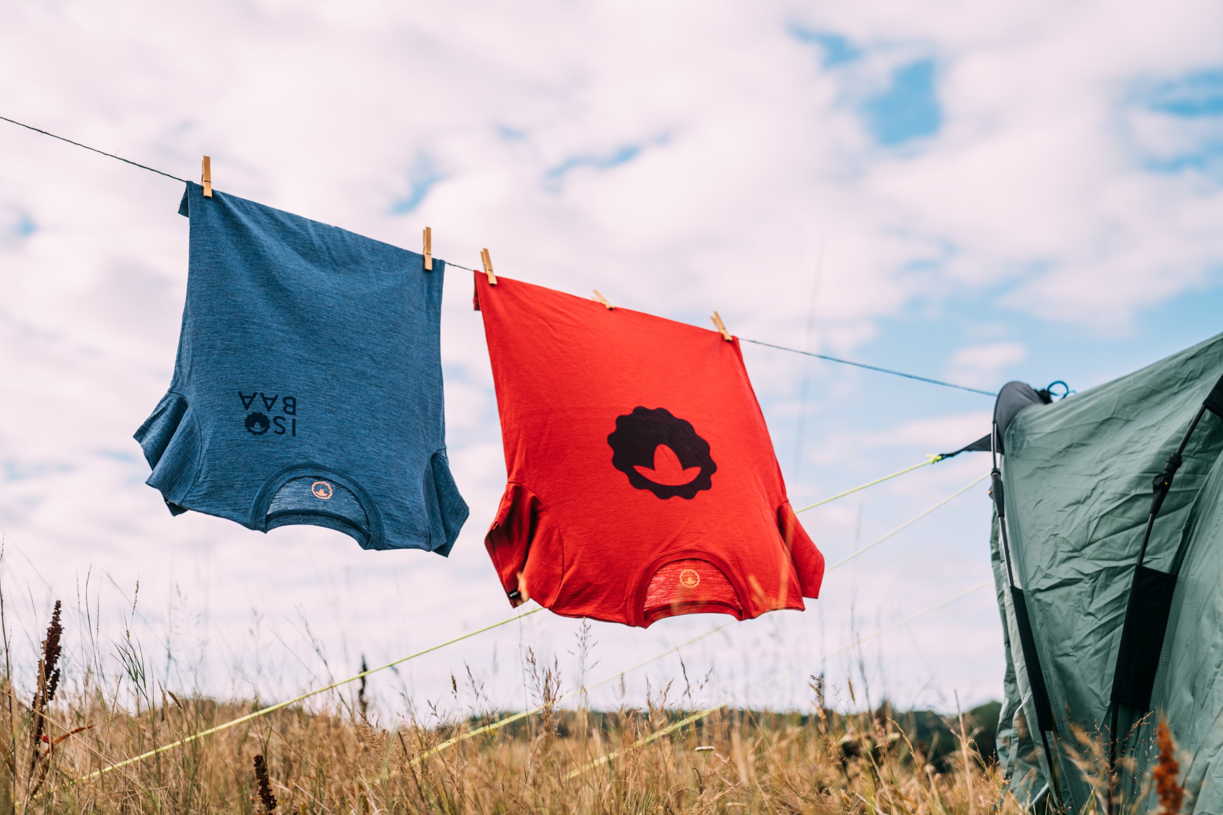 Isobaa Merino Tees hanging on a clothes line on a sunny day