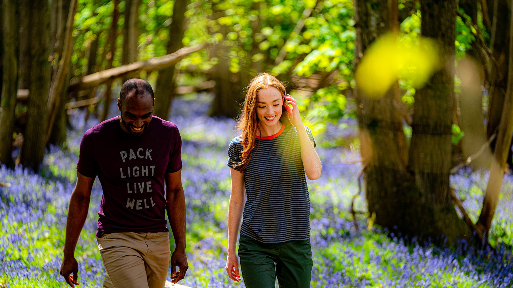 Isobaa Pack Light Tee and Roll Sleeve Tee in Summer forest with bluebells on the ground 