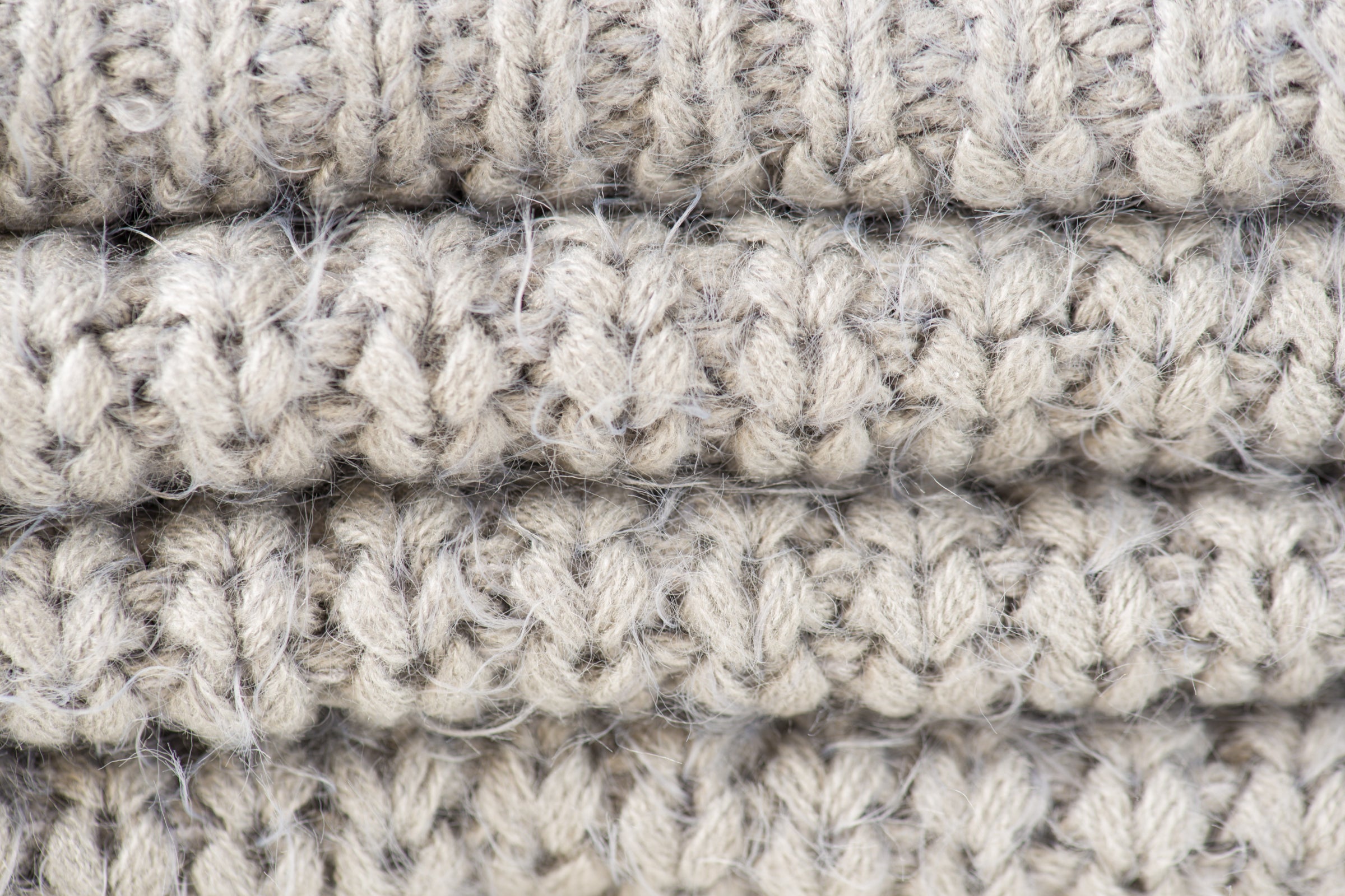 Close-up of thick, coarse wool knit fabric texture