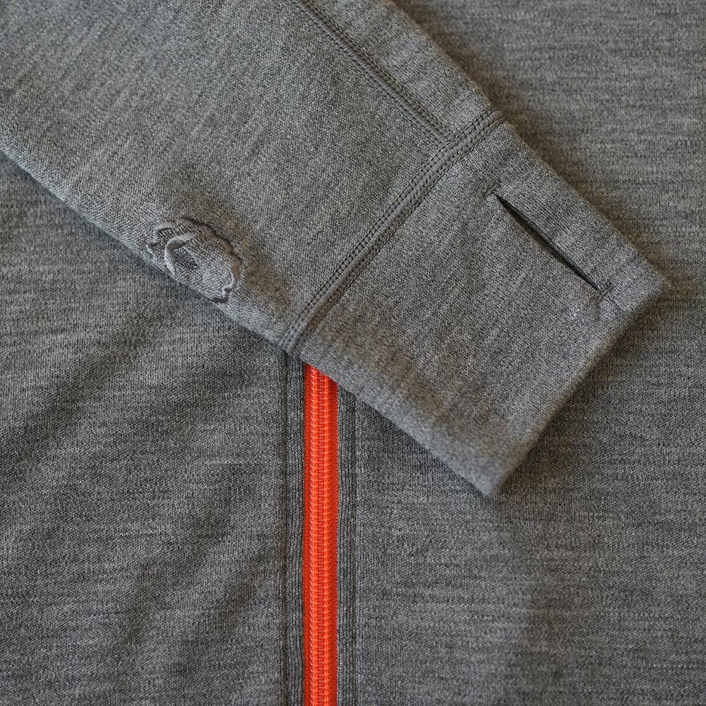 Isobaa | Womens 320 Merino Full Zip (Charcoal/Orange) | Step into a new level of comfort and versatility with our 320 Merino Full Zip Jacket