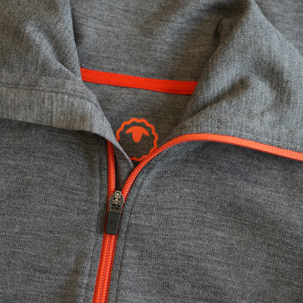 Isobaa | Womens 320 Merino Full Zip (Charcoal/Orange) | Step into a new level of comfort and versatility with our 320 Merino Full Zip Jacket
