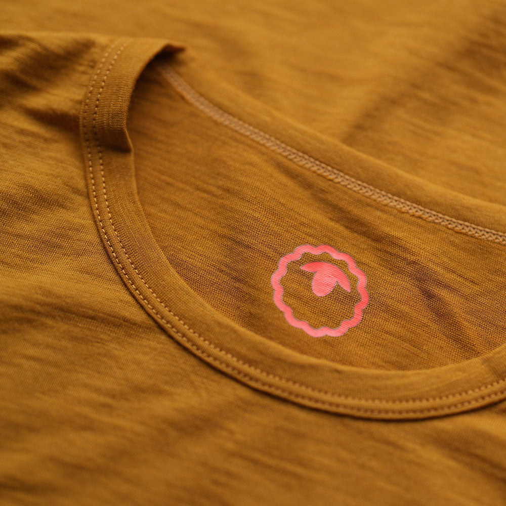 Isobaa | Womens Merino 150 Emblem Tee (Mustard/Navy) | Conquer trails and city streets in comfort with Isobaa's superfine Merino T-Shirt.
