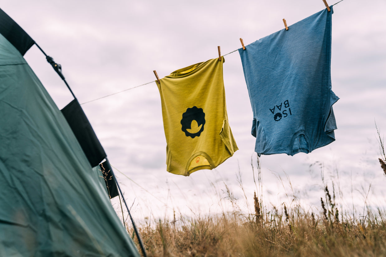 Isobaa Merino Tees hanging on a clothes line on a summer day