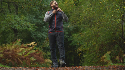 Isobaa | Mens Merino Wool Insulated Gilet (Navy/Orange) | Fight the chill with our innovative Merino gilet. | align: 50% 40% | Model: Shaquille