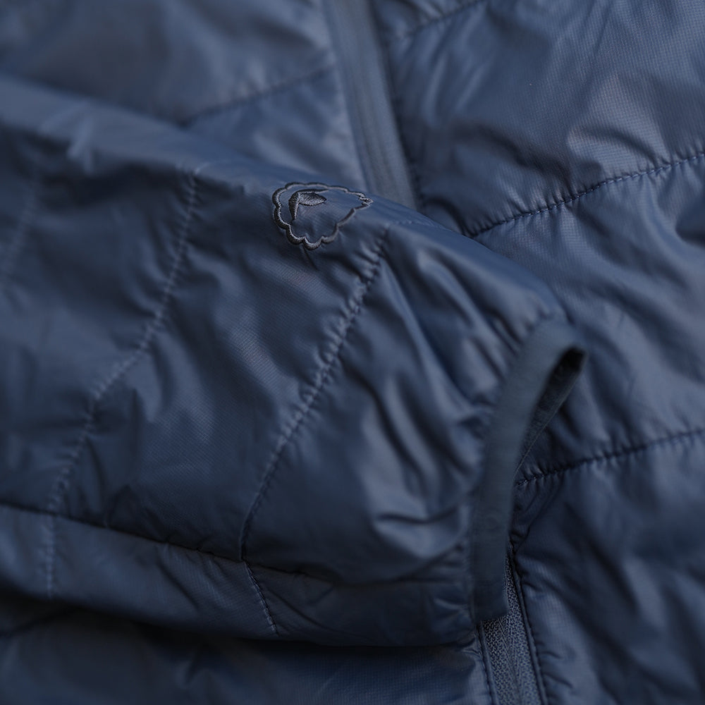 Isobaa | Mens Packable Insulated Jacket (Denim/Navy) | Exceptional warmth, packable convenience, and sustainable design with our lightweight Merino wool jacket.