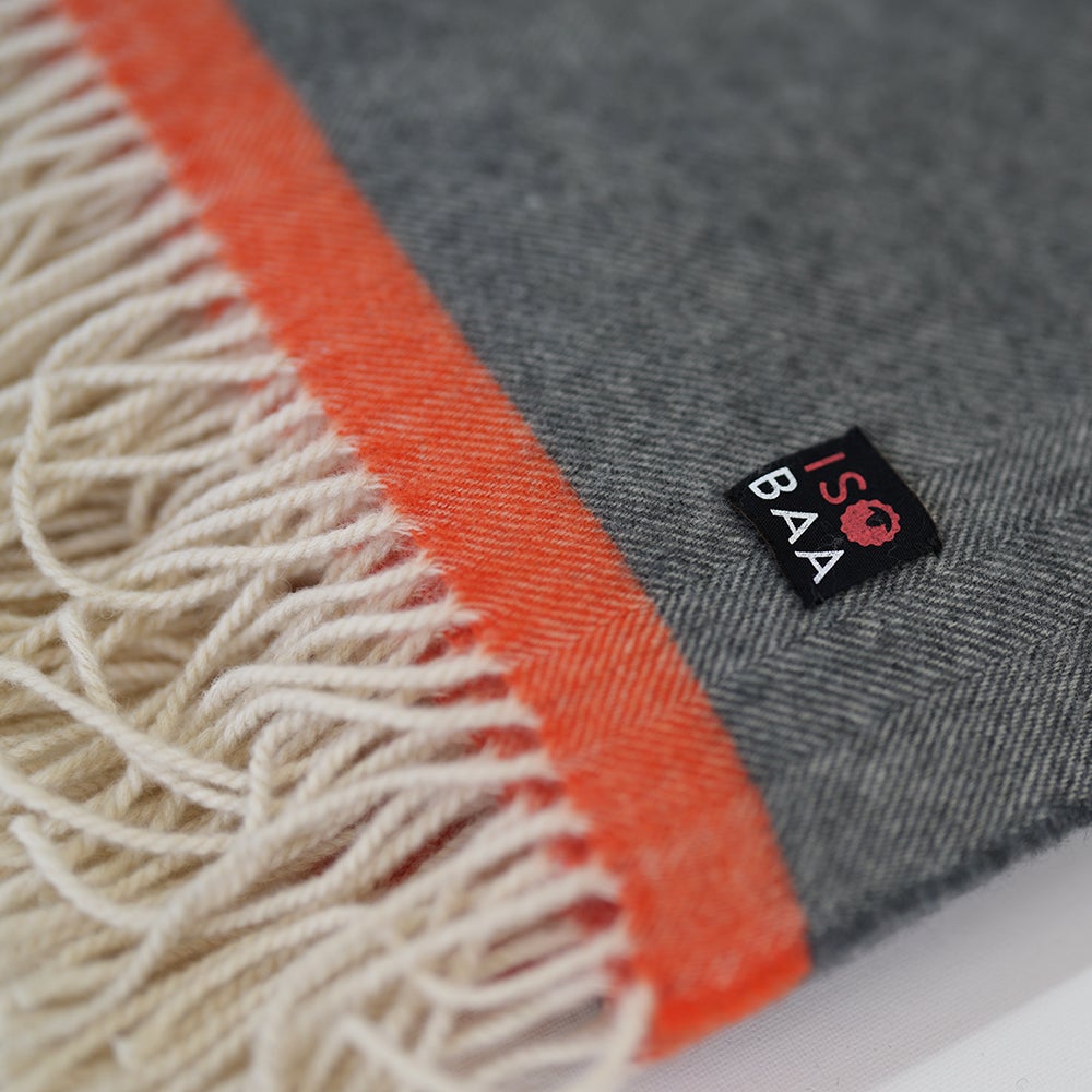 Isobaa | Merino Herringbone Throw (Charcoal/Orange Stripe) | Wrap yourself in pure comfort with Isobaa's super-soft Merino throw.