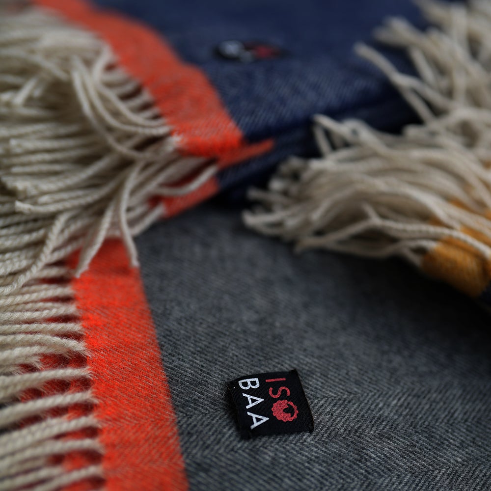 Isobaa | Merino Herringbone Throw (Charcoal/Orange Stripe) | Wrap yourself in pure comfort with Isobaa's super-soft Merino throw.