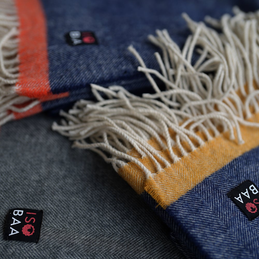 Isobaa | Merino Herringbone Throw (Navy/Mustard Stripe) | Wrap yourself in pure comfort with Isobaa's super-soft Merino throw.