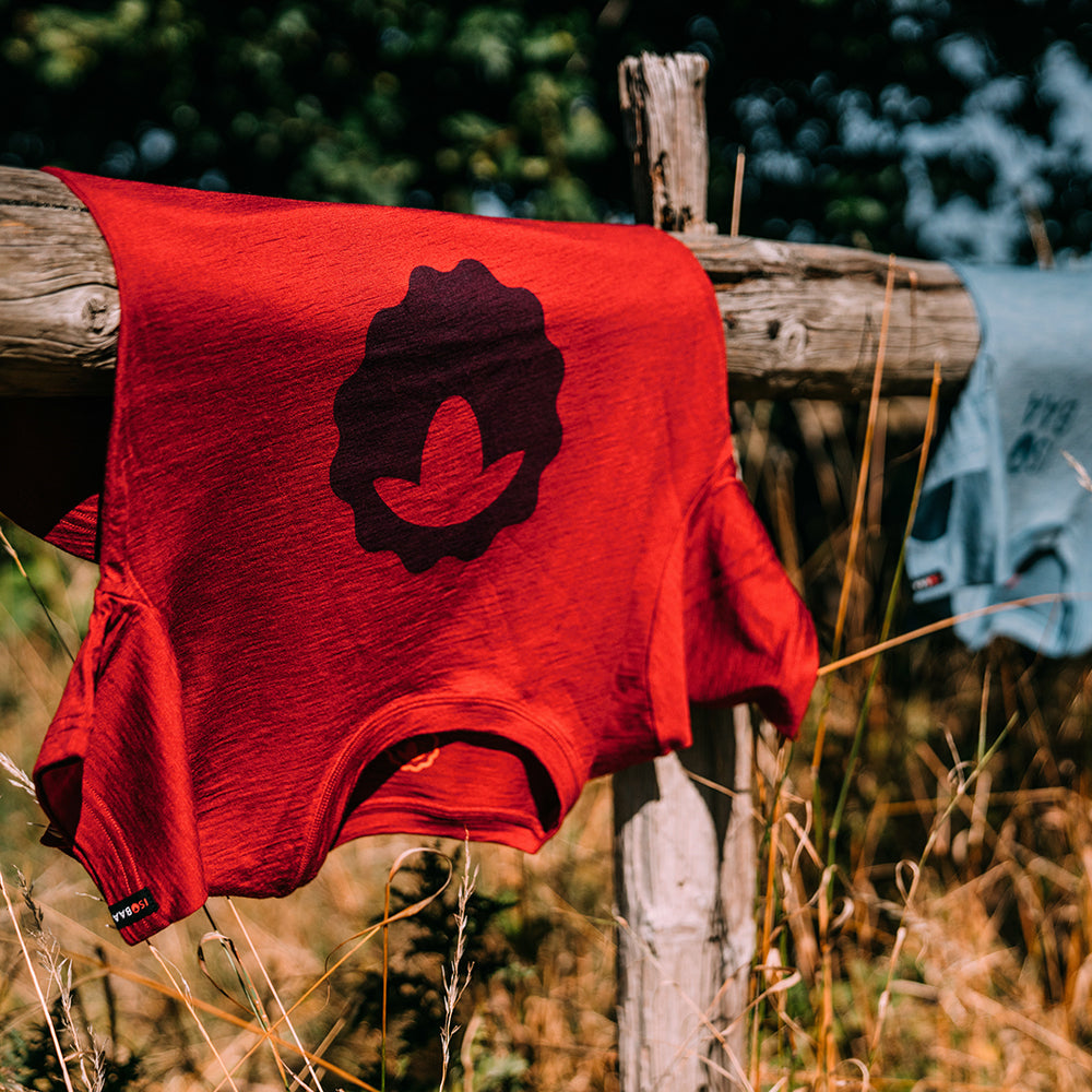 Isobaa | Womens Merino 150 Emblem Tee (Red) | Conquer trails and city streets in comfort with Isobaa's superfine Merino T-Shirt.