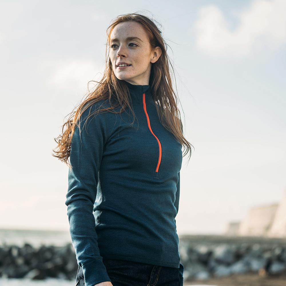 Isobaa | Womens Merino 320 Long Sleeve Half Zip (Petrol/Orange) | Conquer cold trails, blustery commutes, and unpredictable weather with the ultimate Merino wool half-zip top.