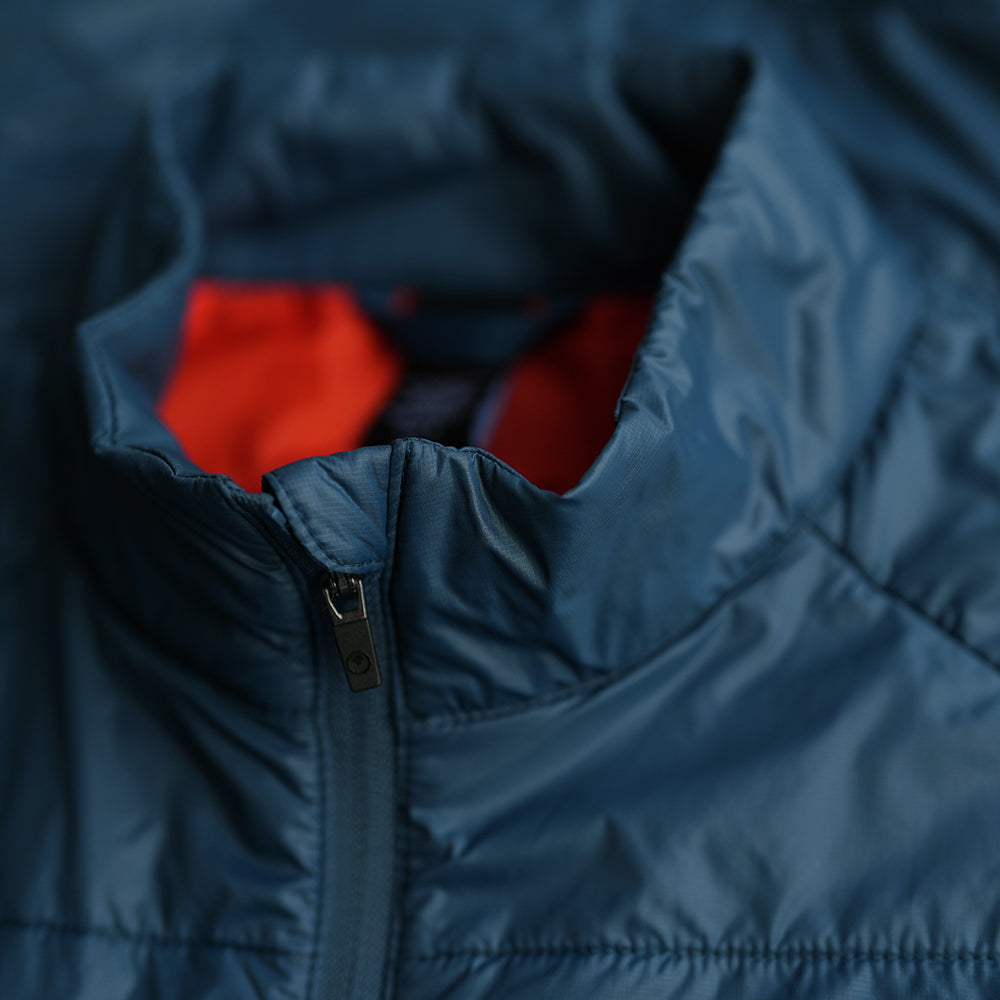 Isobaa | Womens Packable Insulated Jacket (Petrol/Orange) | Exceptional warmth, packable convenience, and sustainable design with our lightweight Merino wool jacket.